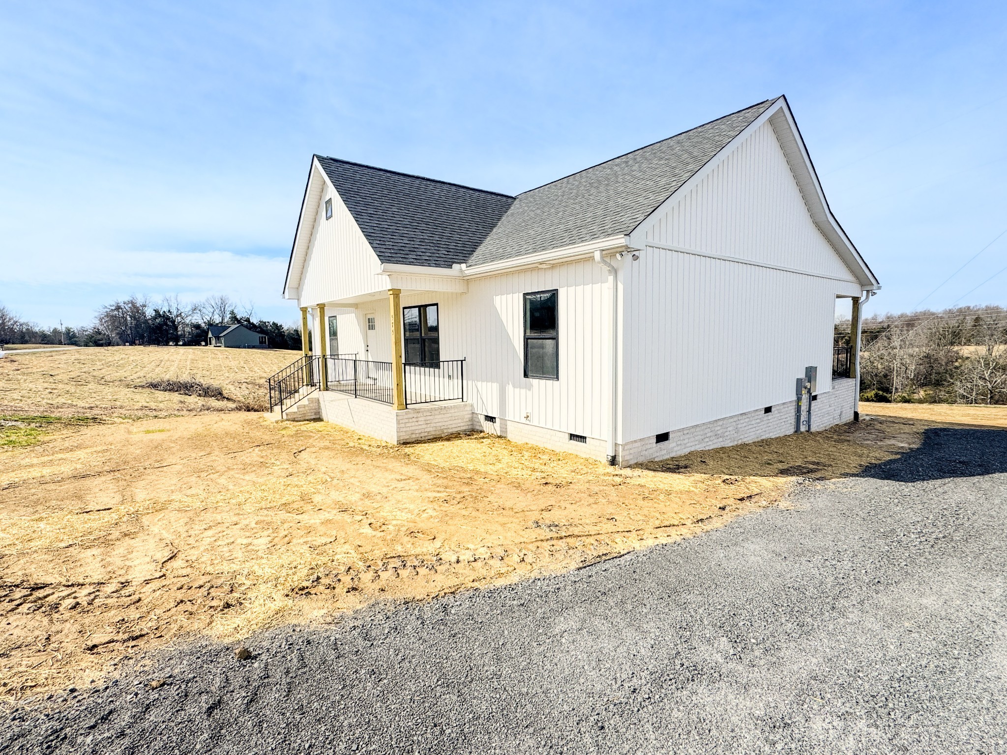 575 Pleasant Hill Road Lafayette, TN 37083 - Photo 33 of 51 a view of a house with a yard and snow in the background