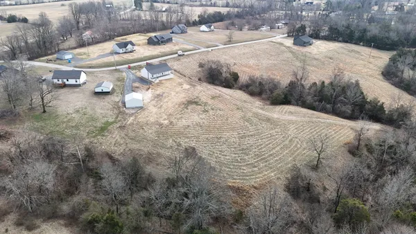 a view of multiple house with backyard