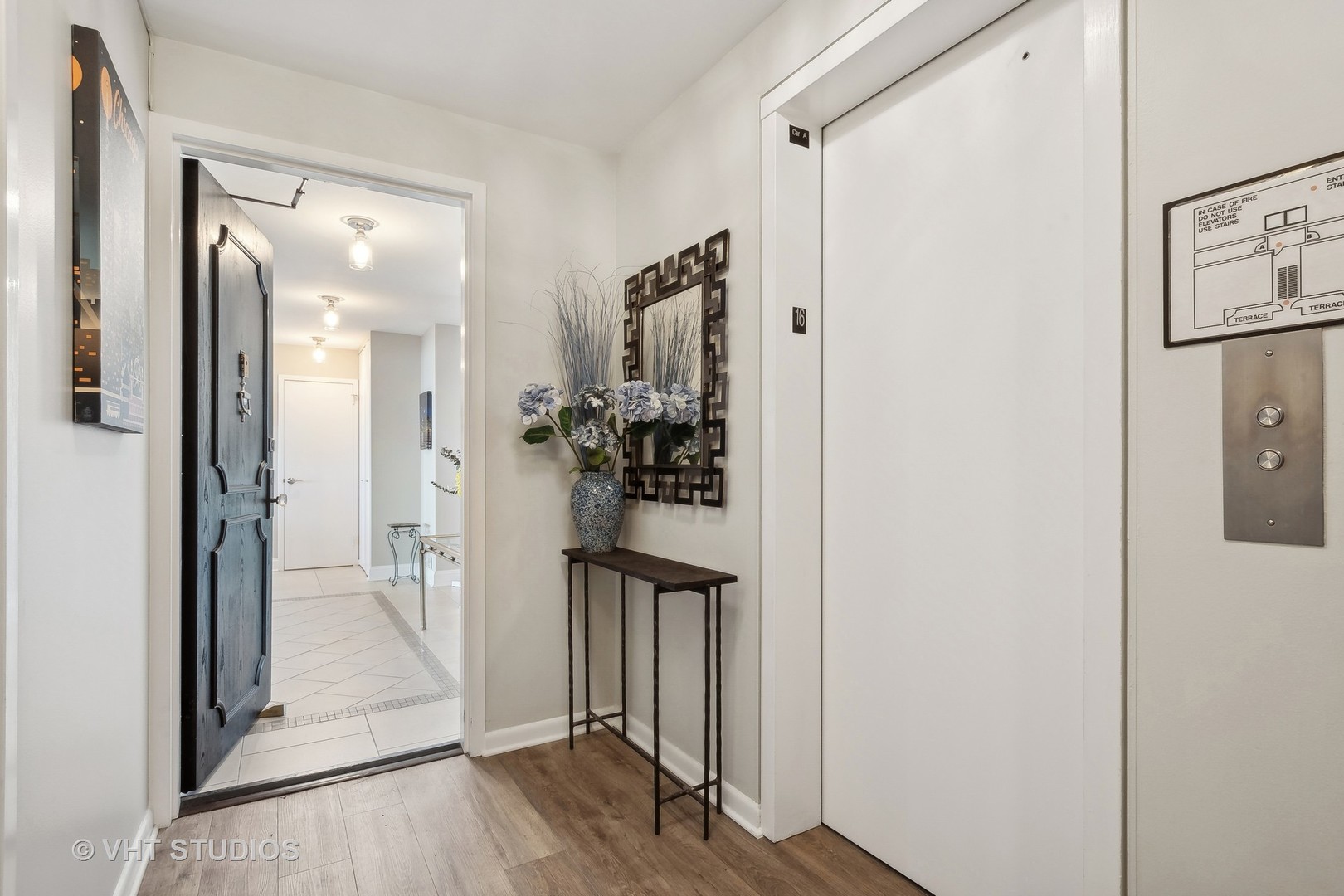5733 North Sheridan Road, Unit 16A Chicago, IL 60660 - Photo 22 of 29 a view of a hallway with wooden floor and closet