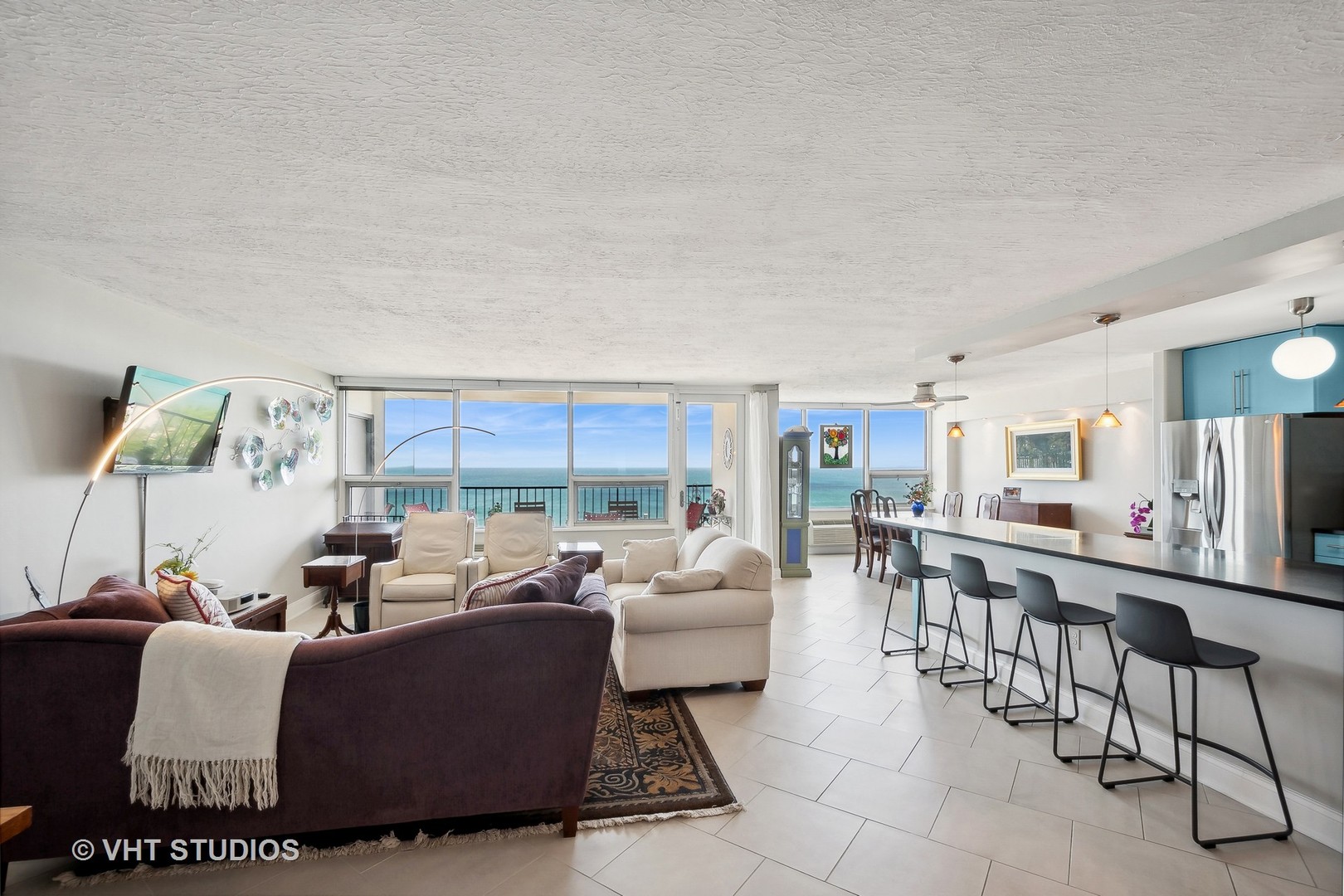 5733 North Sheridan Road, Unit 16A Chicago, IL 60660 - Photo 4 of 29 a living room with furniture and a large window