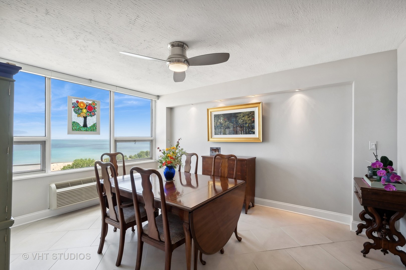 5733 North Sheridan Road, Unit 16A Chicago, IL 60660 - Photo 7 of 29 a view of a dining room with furniture and chandelier