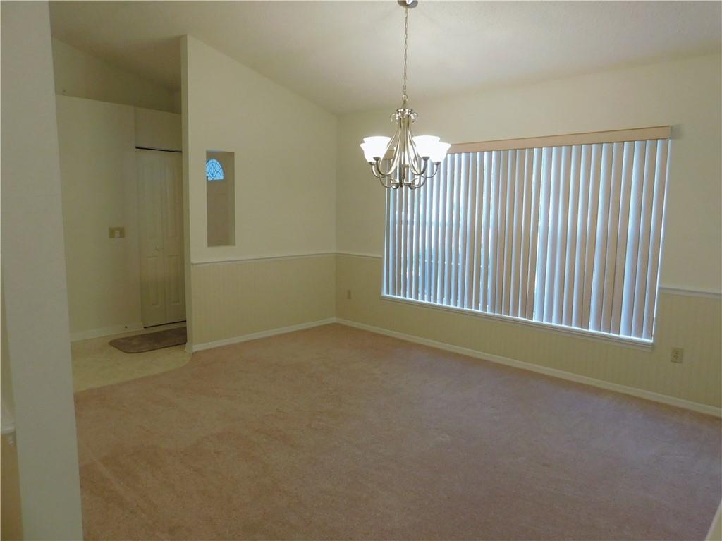7601 Pensacola Road Fort Pierce, FL 34951 - Photo 3 of 14 a view of an empty room with a window