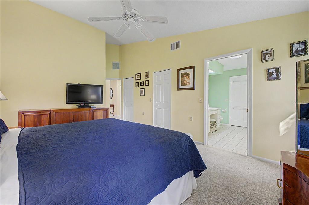 2662 Appleleaf Court Spring Hill, FL 34606 - Photo 17 of 47 a bedroom with a bed and a flat screen tv