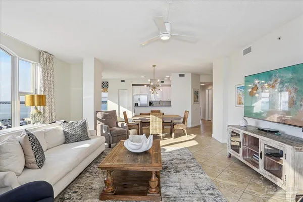 a kitchen with granite countertop a sink stove and cabinets