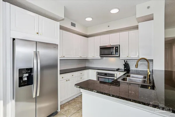 a bathroom with a tub sink and window