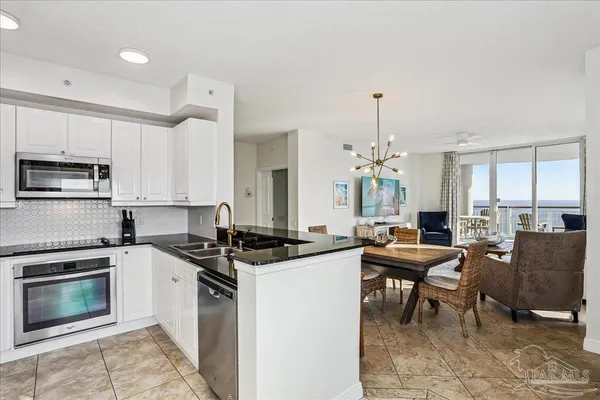 a bathroom with a tub a mirror and a shower