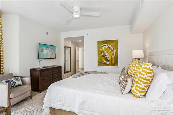 a bedroom with a bed and a dresser