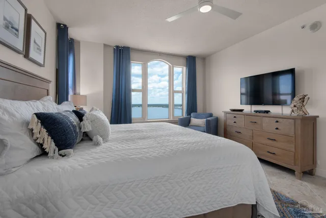 a bathroom with a granite countertop sink a toilet and a mirror