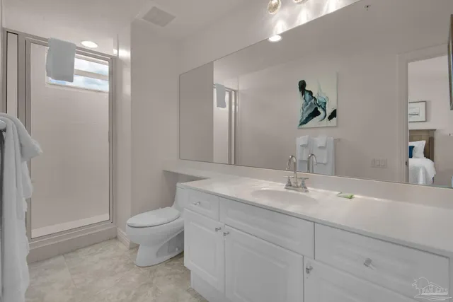 a bedroom with a large bed and a balcony view