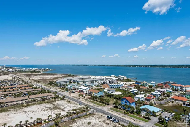 a spacious bedroom with two beds and large window