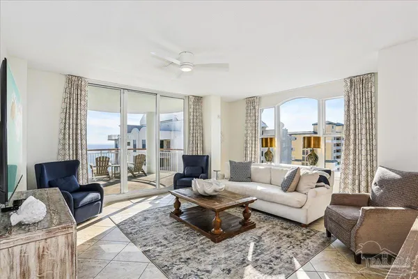 a living room with furniture fireplace and a flat screen tv