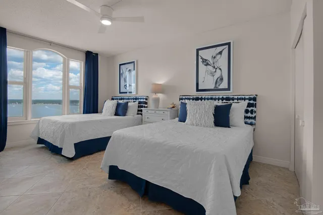 a bedroom with a large bed and a couch