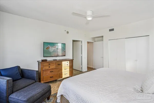a view of a patio with table and chairs and potted plants