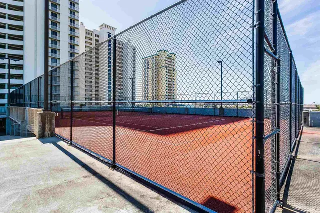 a view of a swimming pool with a yard