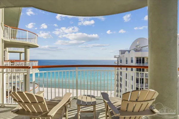 a view of a hallway that has closet and furniture