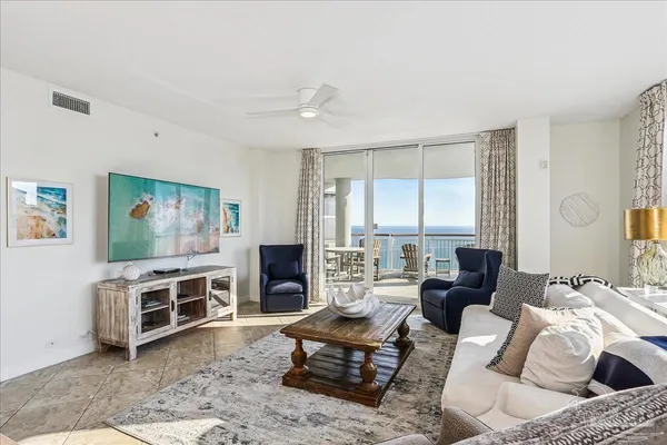 a living room with lots of furniture and a rug