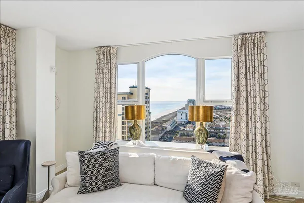 a kitchen with granite countertop white cabinets and stainless steel appliances