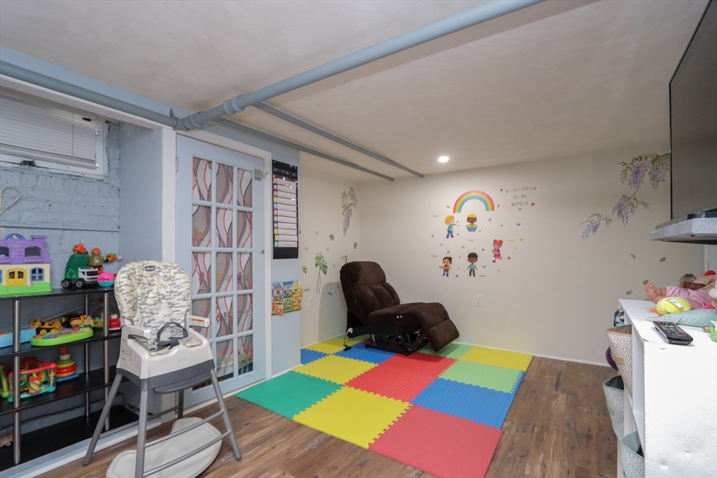 34 Preston Street Springfield, MA 01109 - Photo 28 of 34 a room with toys and a wooden floor