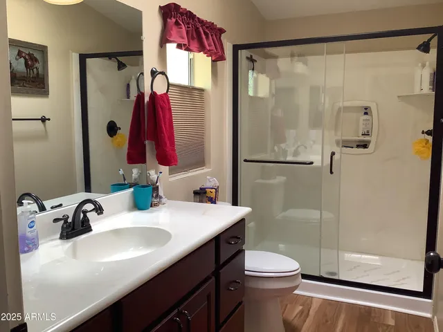 a bedroom with a bed and cabinets