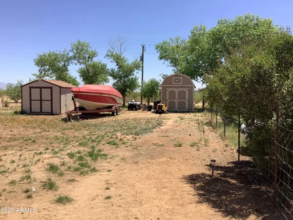 a car parked in front of white house