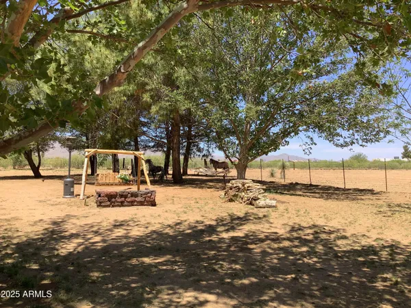 a bench is sitting in middle of a yard