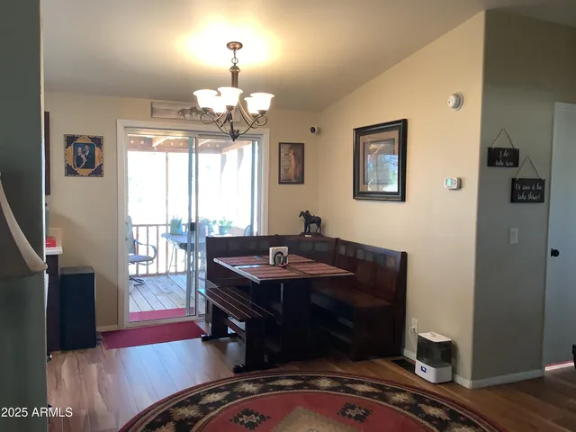 a kitchen with a sink refrigerator and cabinets