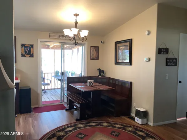 a kitchen with a sink refrigerator and cabinets