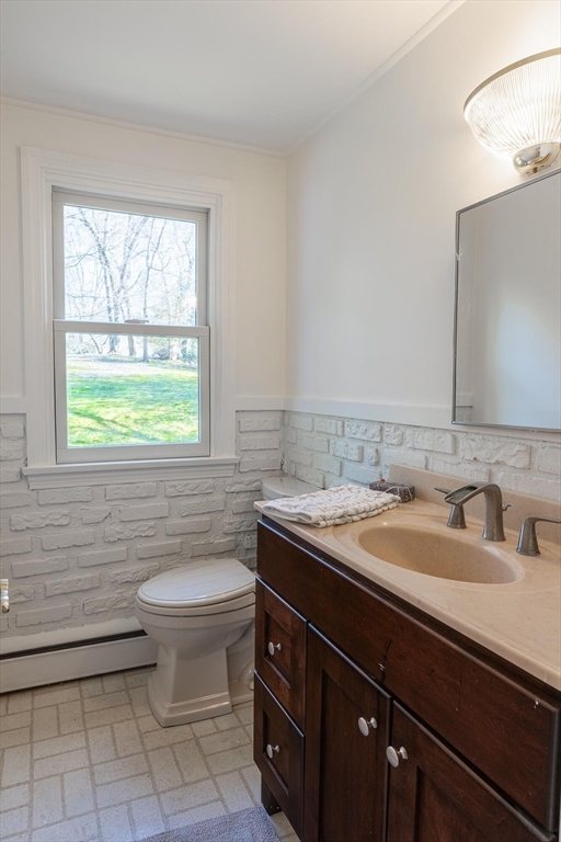 41 Labor In Vain Road Ipswich, MA 01938 - Photo 13 of 33 a bathroom with a sink a toilet and mirror
