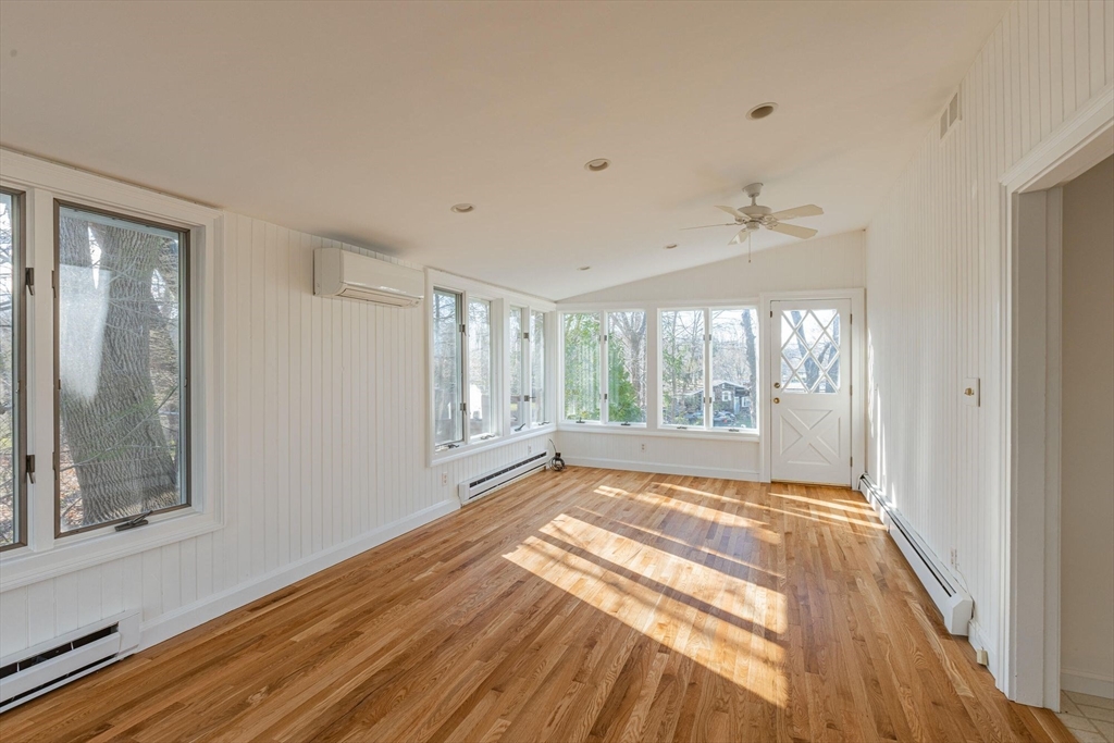 41 Labor In Vain Road Ipswich, MA 01938 - Photo 17 of 33 a view of an empty room with a window and wooden floor