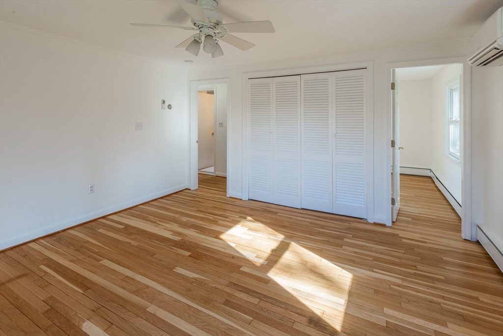 41 Labor In Vain Road Ipswich, MA 01938 - Photo 24 of 33 a view of a big room with wooden floor and closet in a room