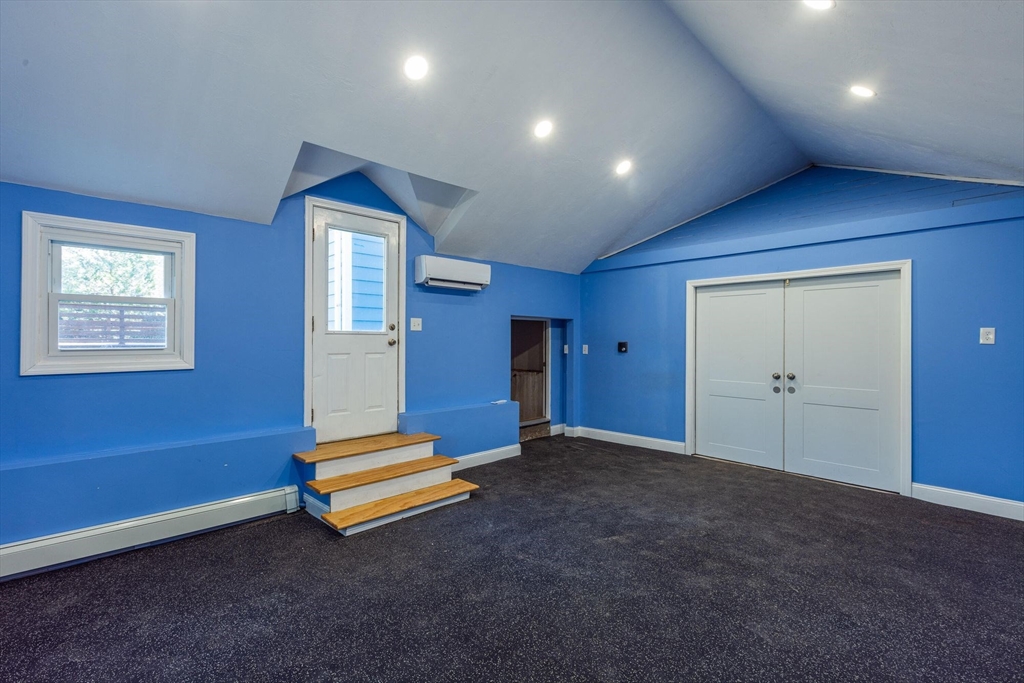 41 Labor In Vain Road Ipswich, MA 01938 - Photo 29 of 33 a view of an empty room with wooden floor and windows