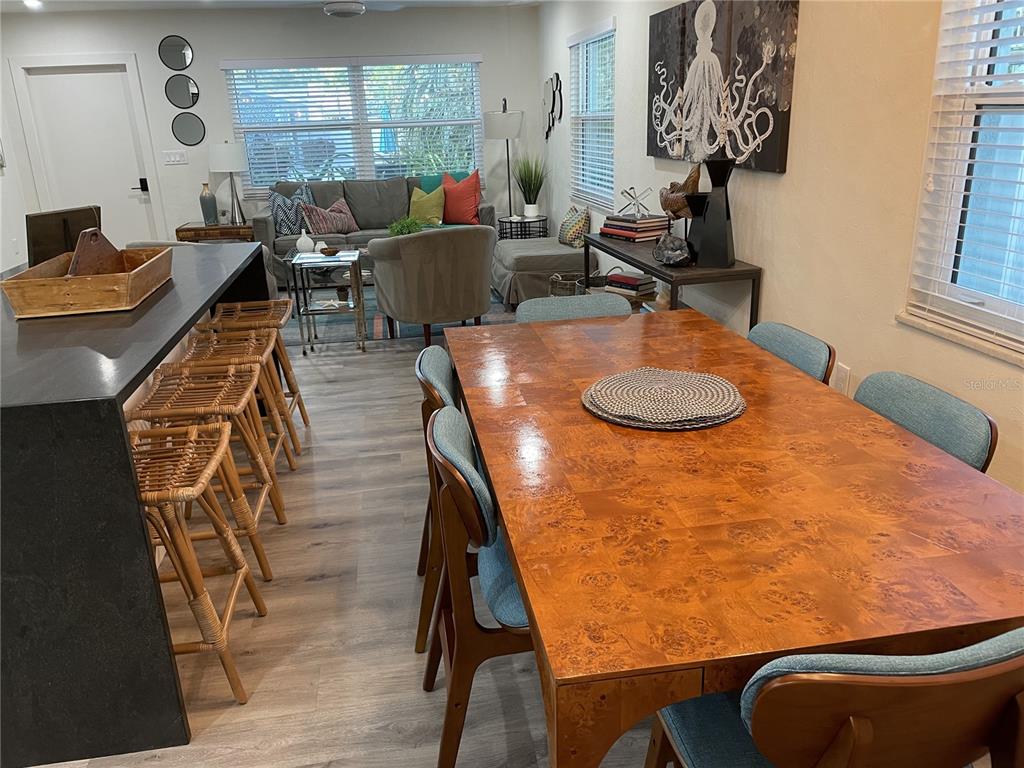 1920 Morrill Street, Unit PINEAPPLE Sarasota, FL 34236 - Photo 13 of 37 a dining room with furniture and wooden floor