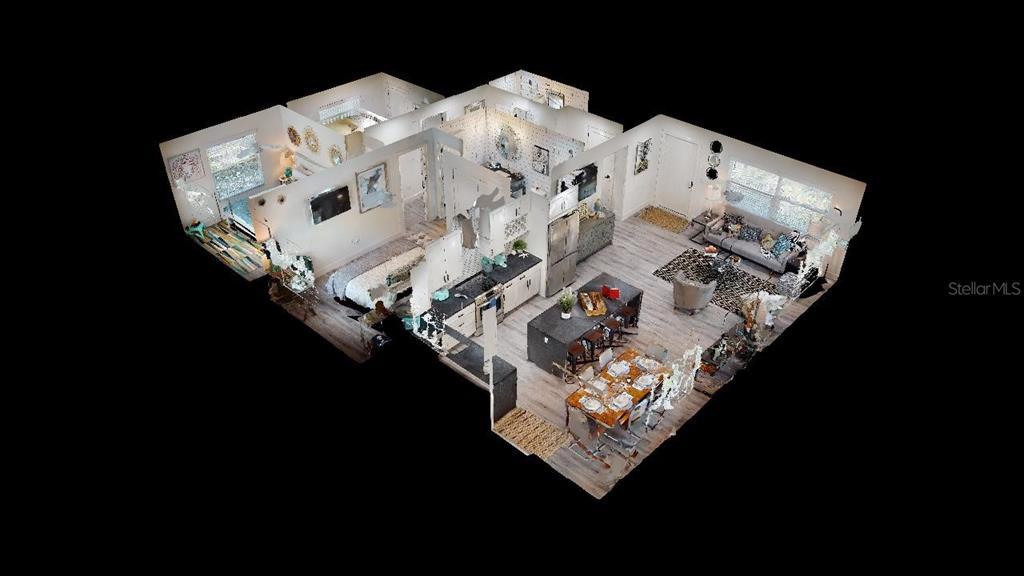 1920 Morrill Street, Unit PINEAPPLE Sarasota, FL 34236 - Photo 26 of 37 a bed sitting in a bedroom next to a lamp