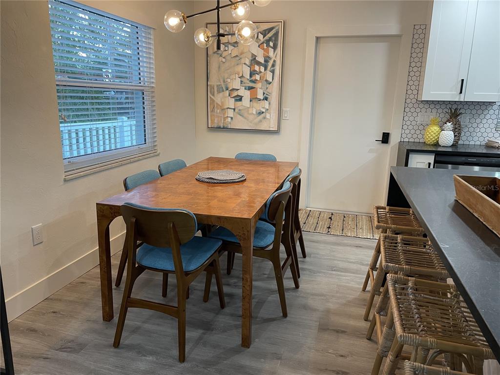 1920 Morrill Street, Unit PINEAPPLE Sarasota, FL 34236 - Photo 27 of 37 a view of a dining room with furniture