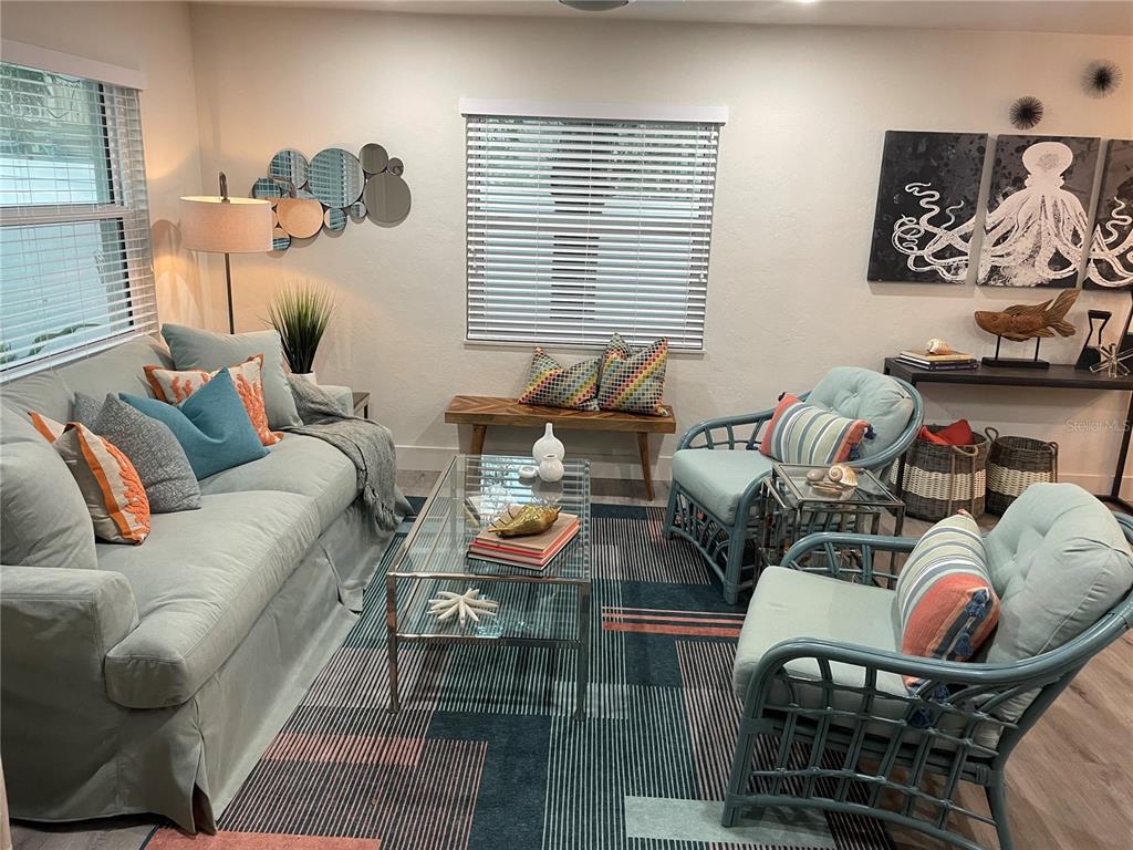 1920 Morrill Street, Unit PINEAPPLE Sarasota, FL 34236 - Photo 31 of 37 a living room with furniture and wooden floor