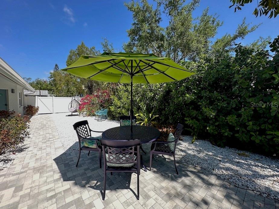 1920 Morrill Street, Unit PINEAPPLE Sarasota, FL 34236 - Photo 32 of 37 a view of a backyard with sitting area and furniture