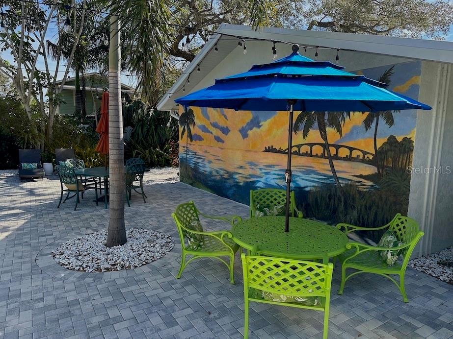 1920 Morrill Street, Unit PINEAPPLE Sarasota, FL 34236 - Photo 36 of 37 a view of a table and chairs in patio