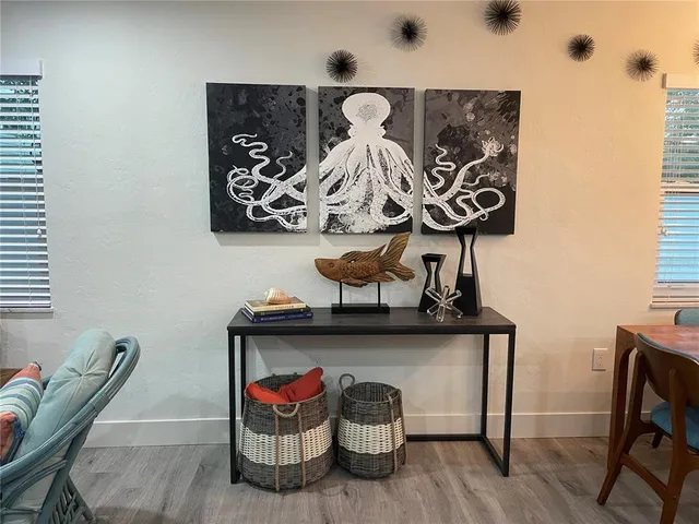 a view of a dinning room with table and chairs