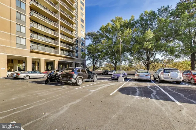 a view of a cars parked in front of a building