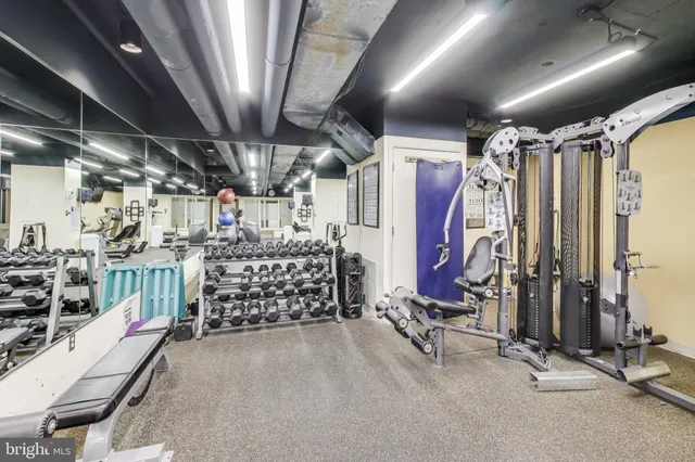 a view of a patio with a table and chairs and couches