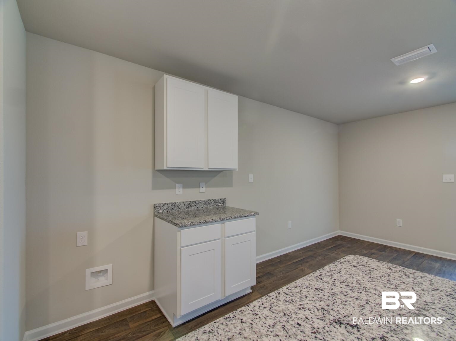 23952 Citation Loop Daphne, AL 36526 - Photo 18 of 69 Kitchen with light stone countertops, white cabinetry, dark wood-style floors, and recessed lighting