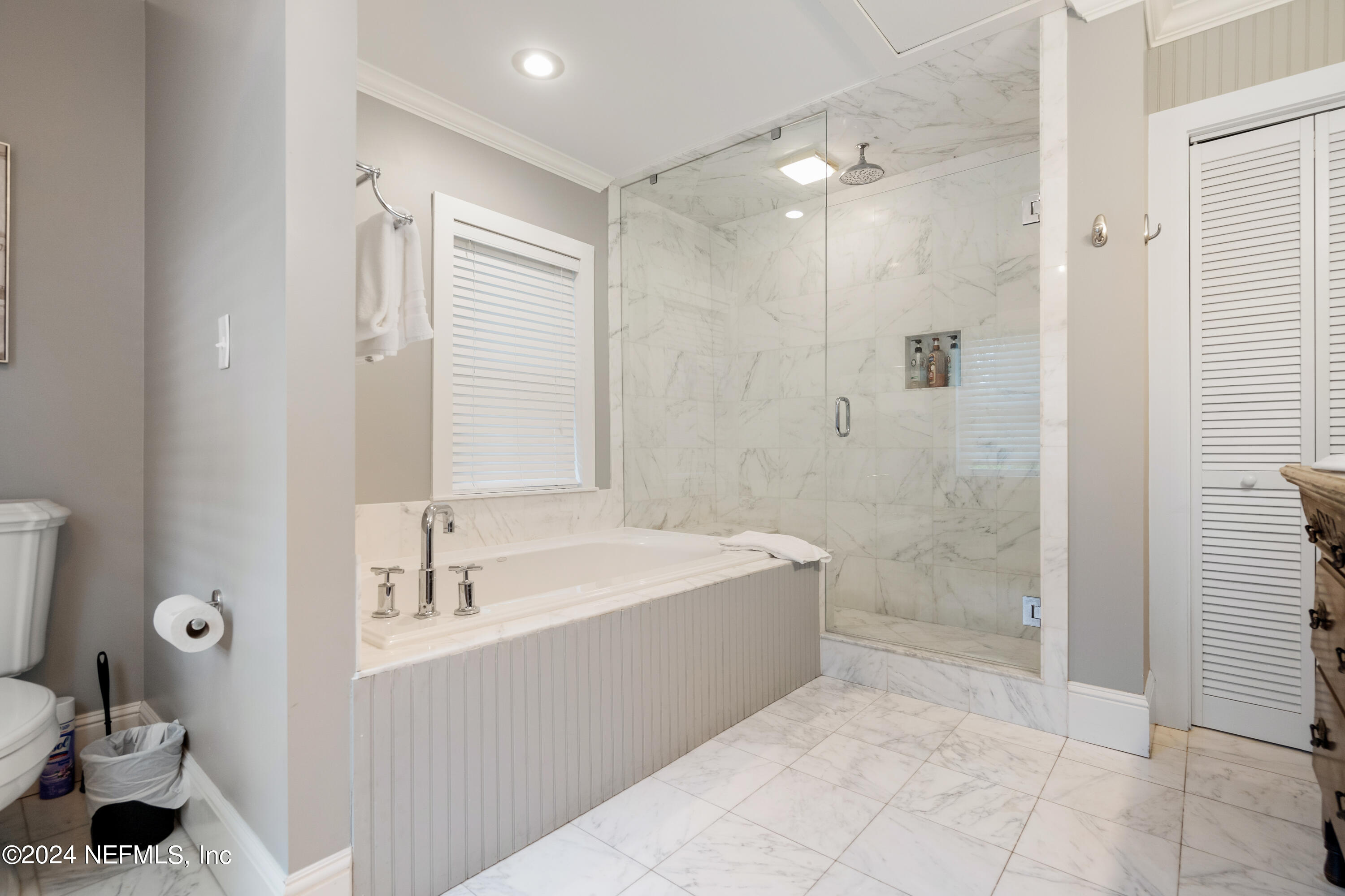 15 Rohde Avenue St. Augustine, FL 32084 - Photo 32 of 36 a spacious bathroom with a tub sink and mirror