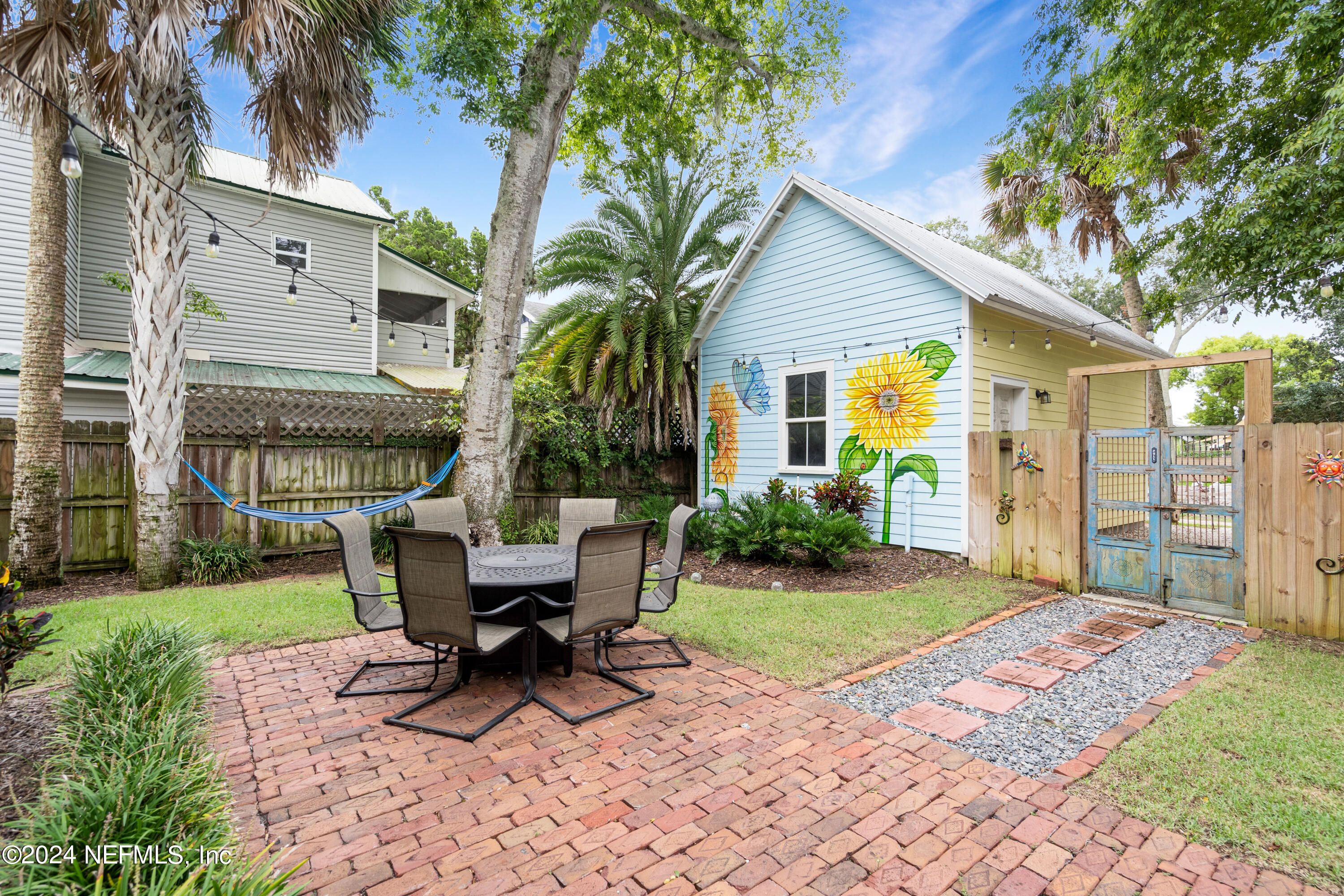 15 Rohde Avenue St. Augustine, FL 32084 - Photo 4 of 36 a view of a house with backyard sitting area and garden