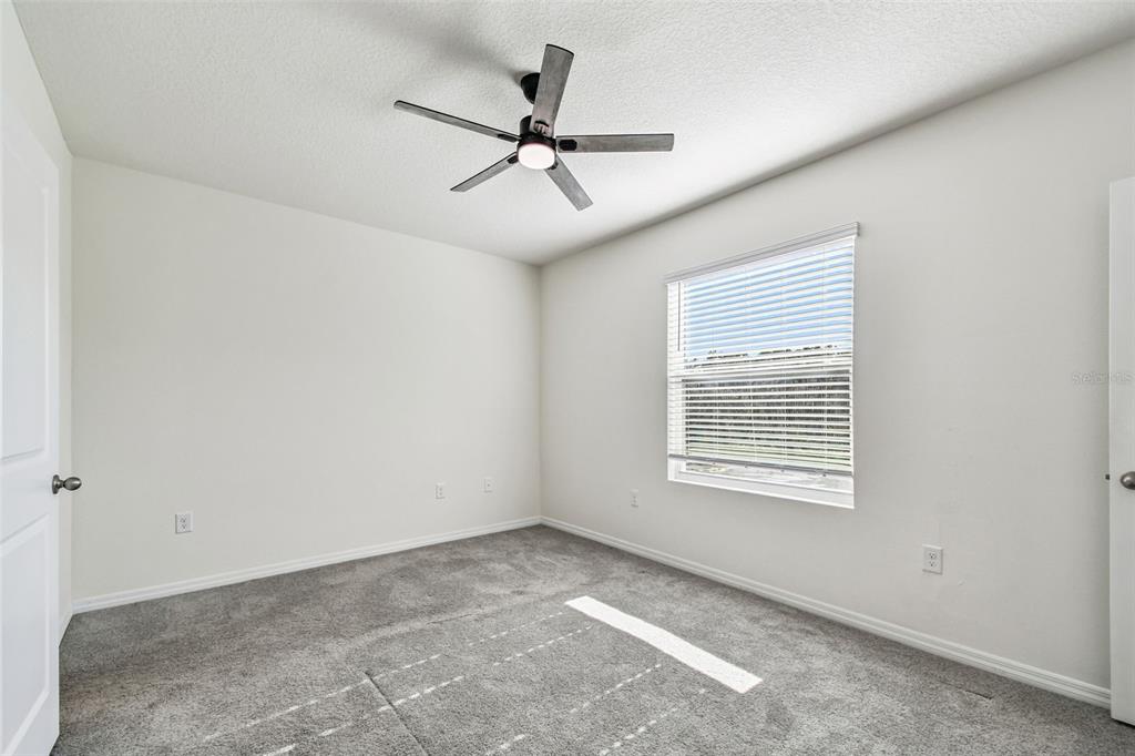 32173 Turtle Grace Loop Wesley Chapel, FL 33545 - Photo 19 of 41 a view of an empty room with a window