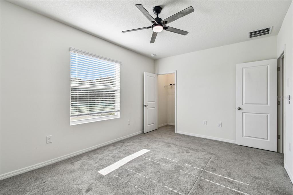 32173 Turtle Grace Loop Wesley Chapel, FL 33545 - Photo 22 of 41 a view of an empty room with a window