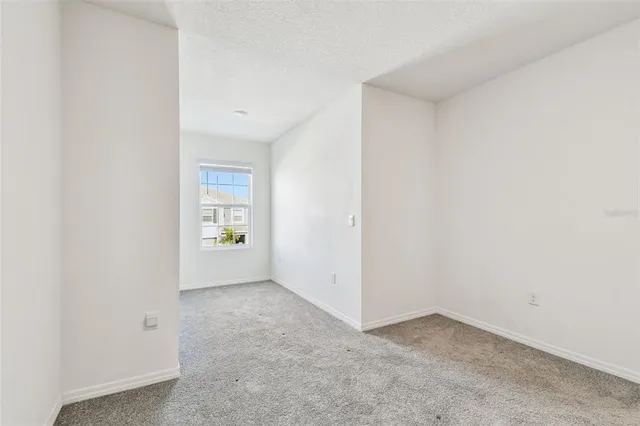 a view of a hallway with windows