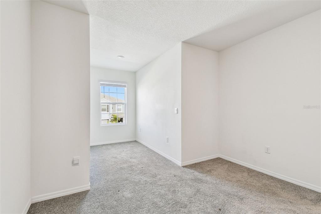 32173 Turtle Grace Loop Wesley Chapel, FL 33545 - Photo 30 of 41 an empty room with windows