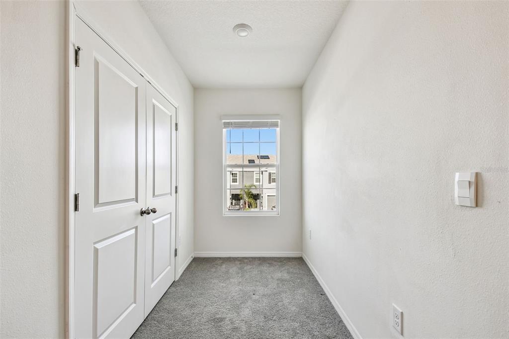 32173 Turtle Grace Loop Wesley Chapel, FL 33545 - Photo 31 of 41 a view of a hallway with windows