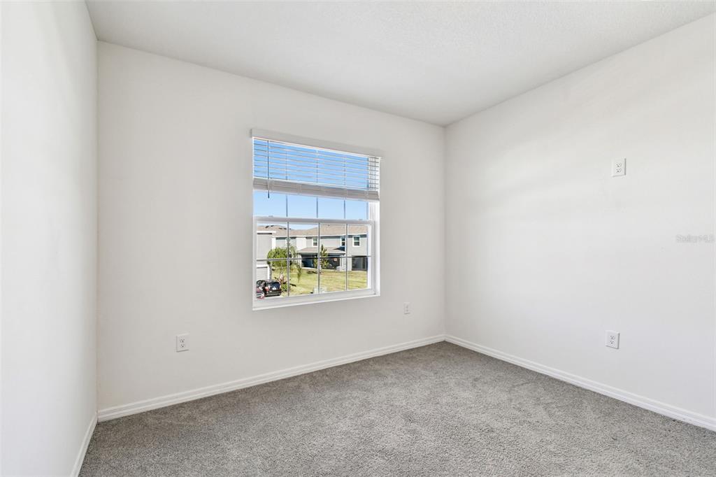 32173 Turtle Grace Loop Wesley Chapel, FL 33545 - Photo 32 of 41 an empty room with a window