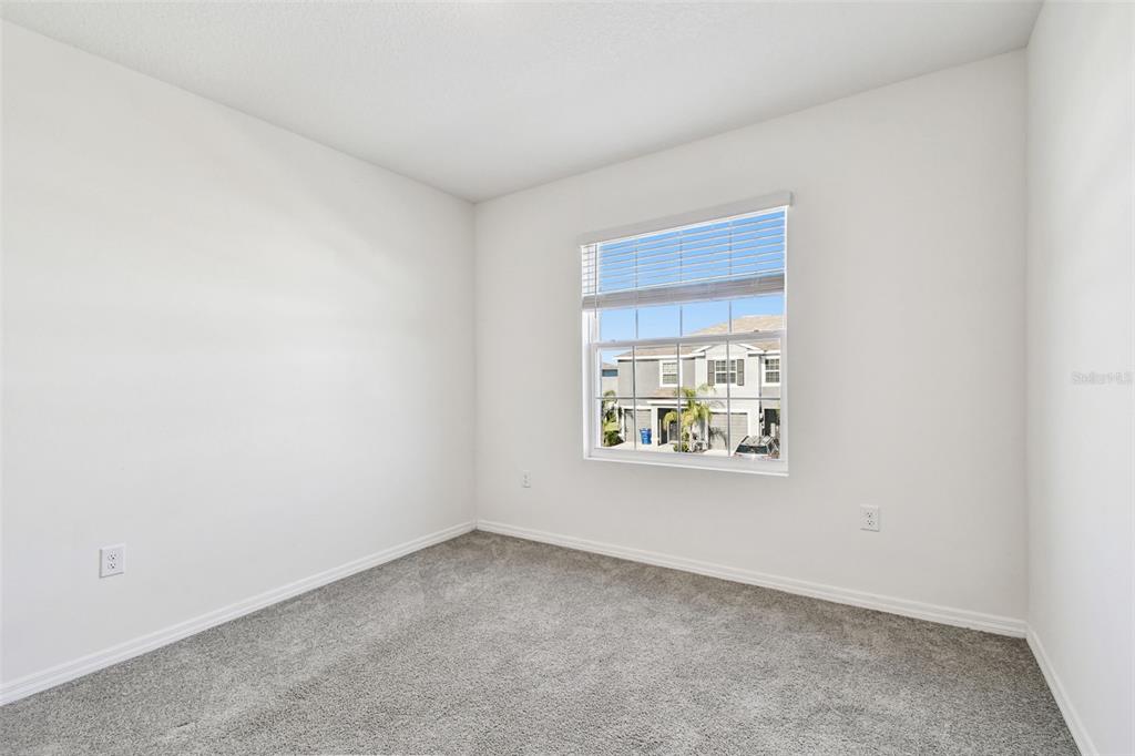 32173 Turtle Grace Loop Wesley Chapel, FL 33545 - Photo 33 of 41 an empty room with windows